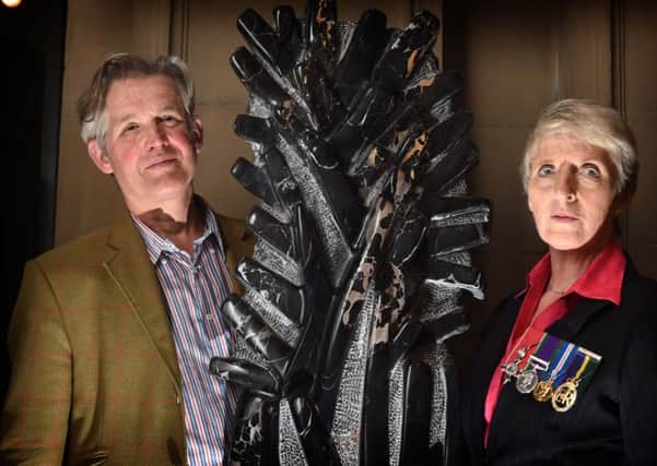 Lieutenant Colonel Helen Homewood and sculptor Simon Burns-Cox with 'France 1914' at the Kelvingrove Art Gallery. Picture: David Findlay/Poppyscotland