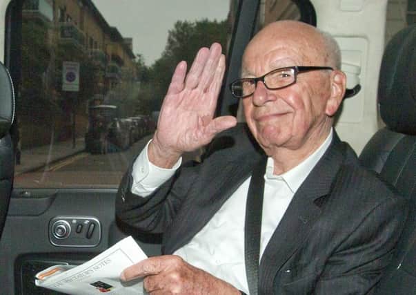 Media Mogul Rupert Murdoch  waves to photographers (Photo: JUSTIN TALLIS/AFP/Getty Images)