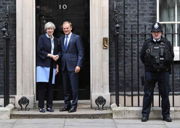 Theresa May greets European Council President Donald Tusk outside 10 Downing Street. Picture: AFP/Getty Images