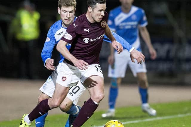 Don Cowie skips past David Wotherspoon  on Wednesday night. Picture: SNS.