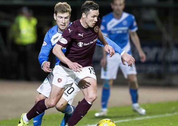 Don Cowie skips past David Wotherspoon on Wednesday night. Picture: SNS.