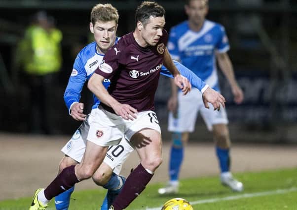 Don Cowie skips past David Wotherspoon  on Wednesday night. Picture: SNS.