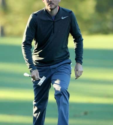 AUGUSTA, GA - APRIL 06:  Russell Henley of the United States walks onto the first green during the first round of the 2017 Masters Tournament at Augusta National Golf Club on April 6, 2017 in Augusta, Georgia.  (Photo by Andrew Redington/Getty Images)
