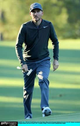AUGUSTA, GA - APRIL 06:  Russell Henley of the United States walks onto the first green during the first round of the 2017 Masters Tournament at Augusta National Golf Club on April 6, 2017 in Augusta, Georgia.  (Photo by Andrew Redington/Getty Images)