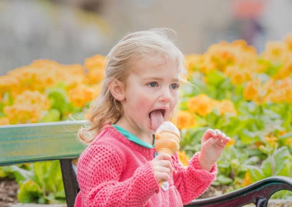 Darcy Sharp, aged two, gives her ice cream big licks in the spring sunshine in Innerleithen in the Scottish Borders yesterday. Picture: Ian Georgeson