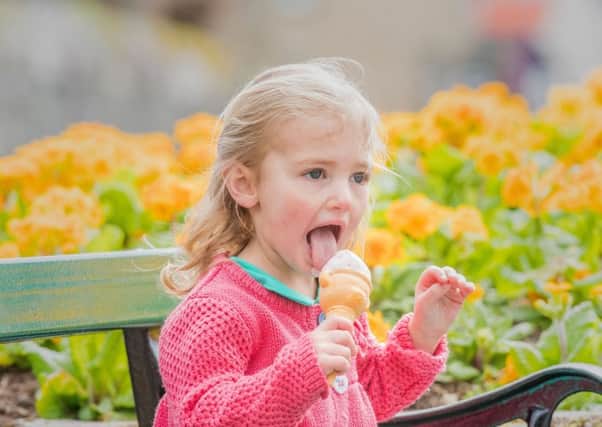 Darcy Sharp, aged two, gives her ice cream big licks in the spring sunshine in Innerleithen in the Scottish Borders yesterday. Picture: Ian Georgeson