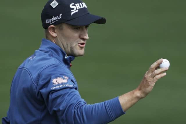 Russell Knox acknowledges the crowd after making his only birdie of the opening round at the second hole. Picture: Getty Images