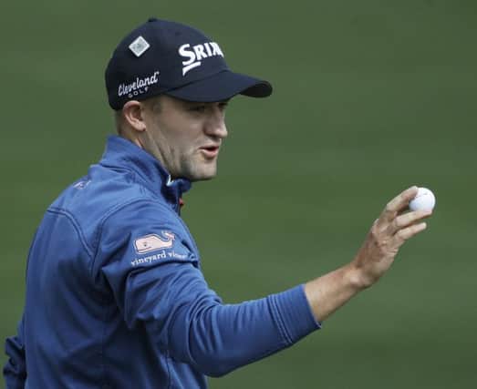 Russell Knox acknowledges the crowd after making his only birdie of the opening round at the second hole. Picture: Getty Images