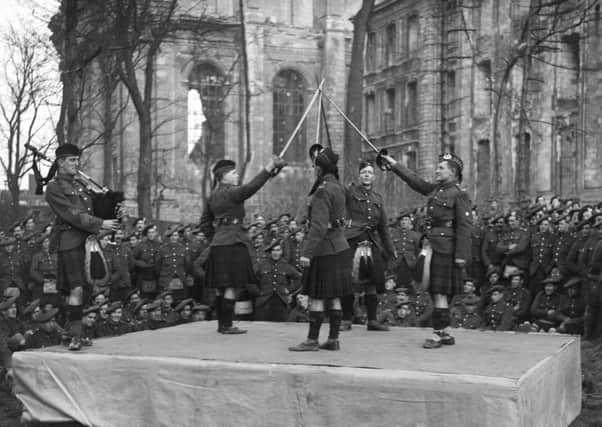 Highland Dance by men of the 8 10th (Service) Battalion, The Gordon Higlanders outside Arras Cathedral, 24 January 1919. Picture: IWM