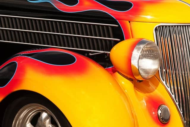 Souped-up cars, like this vintage Hot Rod, pay a premium