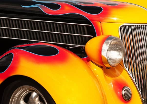 Souped-up cars, like this vintage Hot Rod, pay a premium