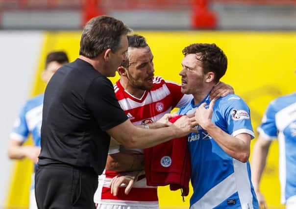 Danny Swanson (right) had to be restrained following his confrontation with team-mate Richard Foster (not pictured). Picture: SNS