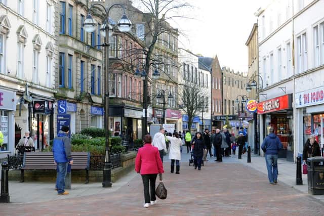 Falkirk High Street. Smaller town centres are in danger of being "hollowed out" as store closures mount, a report has warned. Picture: John Devlin