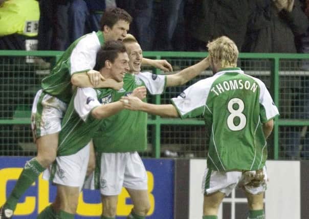 The two players were Hibs team-mates earlier in their career. Picture: SNS