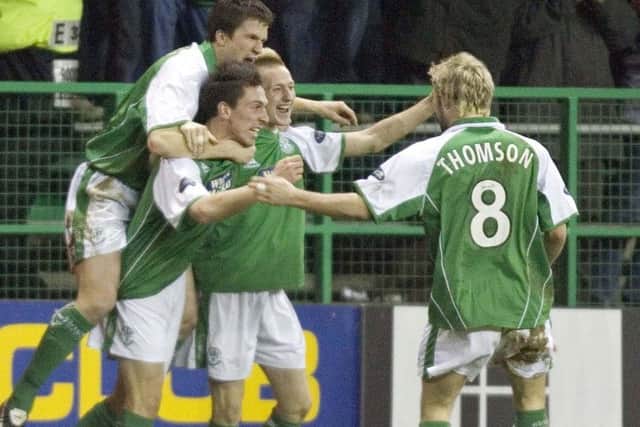 The two players were Hibs team-mates earlier in their career. Picture: SNS