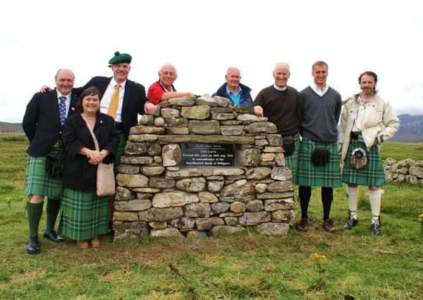 Members of the Clan Currie Society at a memorial cairn to the family poets in South Uist. PIC: Contributed.
