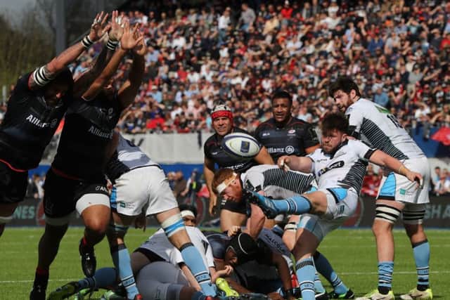 Ali Price attempts to launch a Glasgow attack as he kicks the ball upfield during the European Champions Cup match against Saracens. Picture: Getty Images