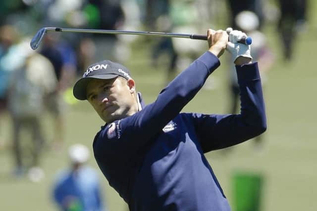 Russell Knox hits a shot on the first hole at Augusta. Picture: AP