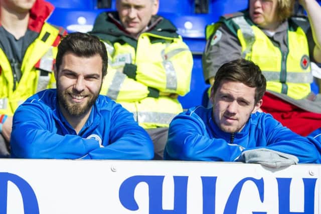 St Johnstone duo Richard Foster and Danny Swanson watch from the stand as they serve their suspension. Pic: SNS/Sammy Turner