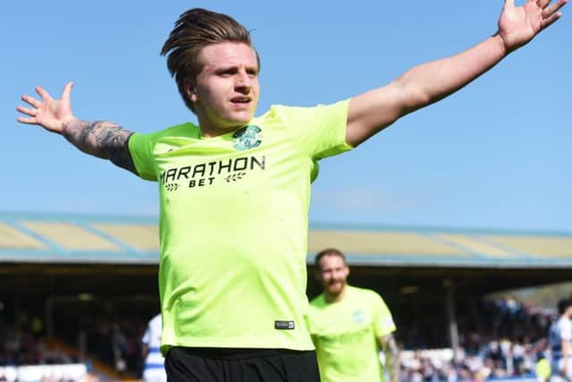 Jason Cummings celebrates putting Hibs ahead against Greenock Morton. Pic: SNS/Craig Williamson