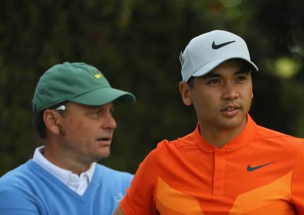 Jason Day was relieved to outscore Augusta National member Jeff Knox, left, who acted as the noncompeting marker for the world No.3. Picture: Andrew Redington/Getty