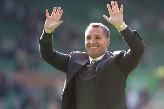 Celtic manager Brendan Rodgers has defended his gesture saying he was 'stretching' his fingers' during the celebrations. Picture; SNS