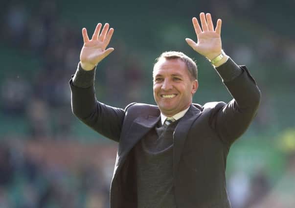 Celtic manager Brendan Rodgers has defended his gesture saying he was 'stretching' his fingers' during the celebrations. Picture; SNS