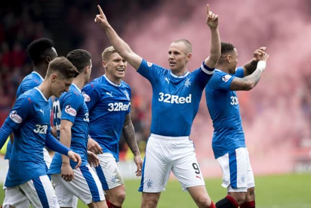 Kenny Miller celebrates after putting Rangers in front. Picture: SNS
