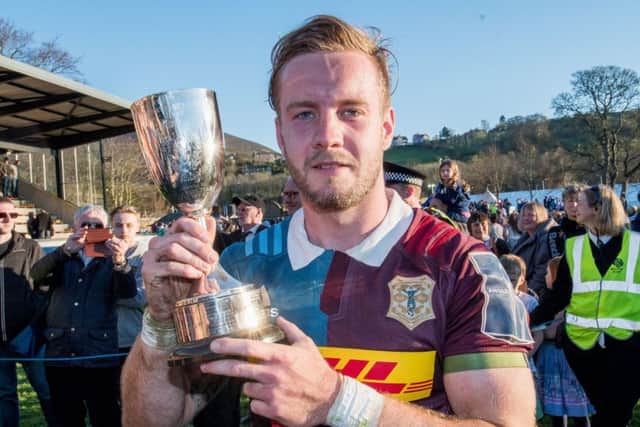 Harlequins captain Charlie Walker with the trophy. Picture: Ian Georgeson.