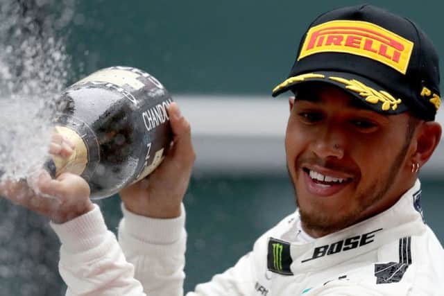 Lewis Hamilton celebrates his first victory of the new season. Picture: Getty.