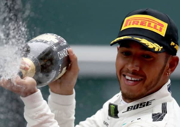 Lewis Hamilton celebrates his first victory of the new season. Picture: Getty.