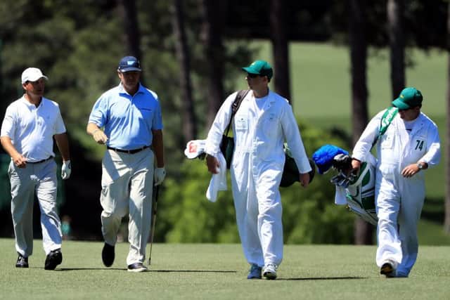 Ernie Els, second left, walks up the 17th hole with playing partner Jeff Knox. Picture: Getty.