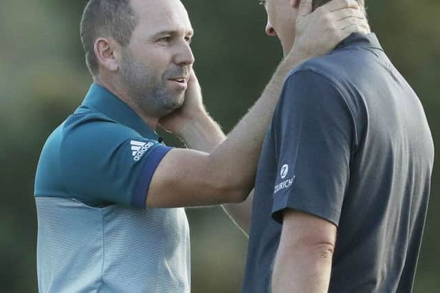 Sergio Garcia and Justin Rose share a few words at the end of their thrilling back-nine battle in the 81st Masters. Picture: Getty Images