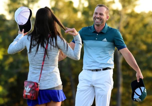 Sergio Garcia  is greeted by fiancee Angela Akins after making his long-awaited major breakthrough in the 81st Masters. Picture: Getty Images