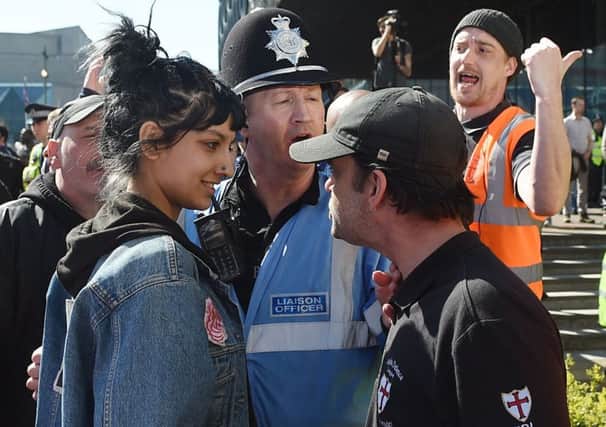 The photograph of Saffiyah Khan facing down Ian Crossland at an EDL demonstration in Birmingham has gone viral. Picture: Joe Giddens/PA Wire