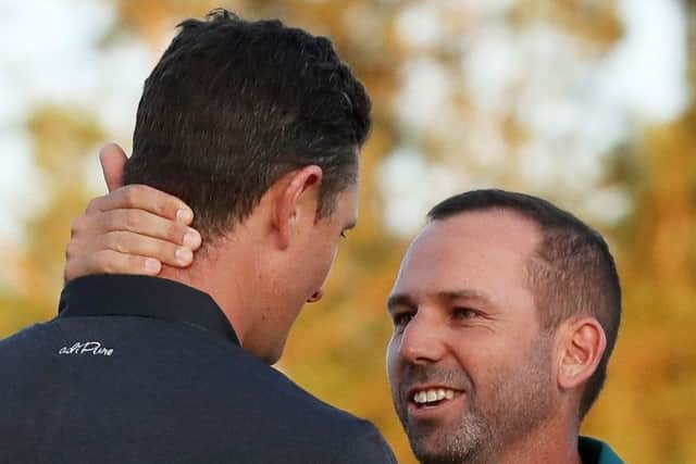 Well done! Justin Rose congratulates Sergio Garcia after Garcia won on the first playoff hole. Picture: Getty