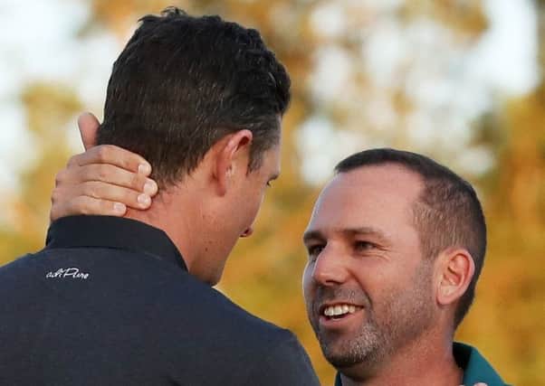 Well done!  Justin Rose congratulates Sergio Garcia after Garcia won on the first playoff hole. Picture: Getty