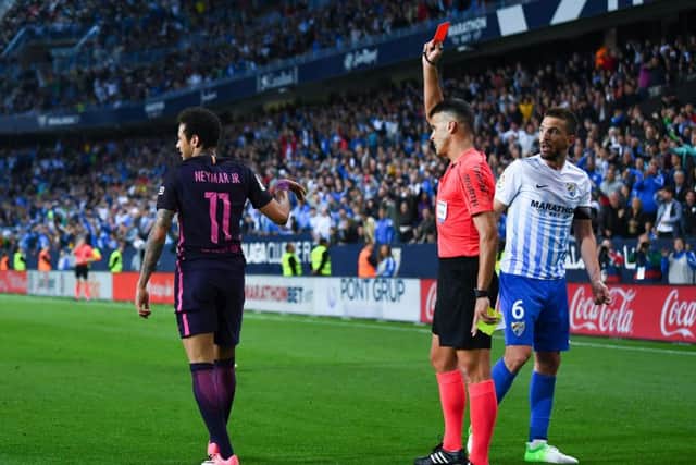 Neymaris sent off during Barcelonas 2-0 defeat by Malaga on Saturday. Picture: Getty.