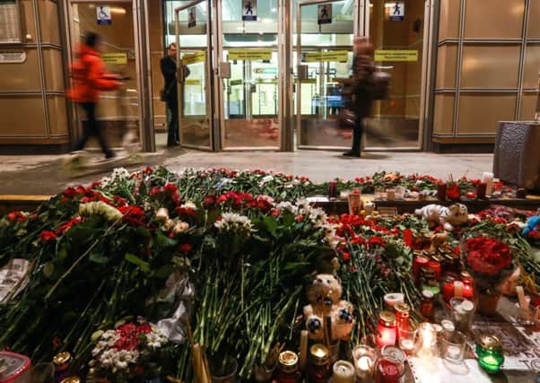 Flowers and candels at Spasskaya metro station in memory of the St Petersburg Metro blast victims. (Photo by Sergei Konkov\TASS via Getty Images)