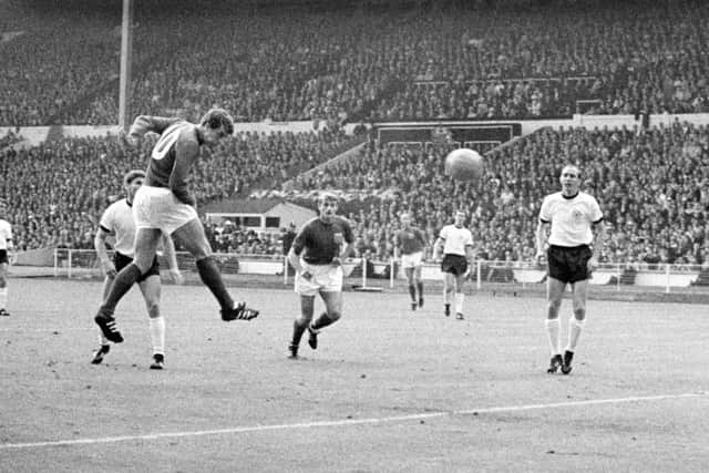 Geoff Hurst (second left) scoring for England against West Germany in the 1966 World Cup final. Picture: PA