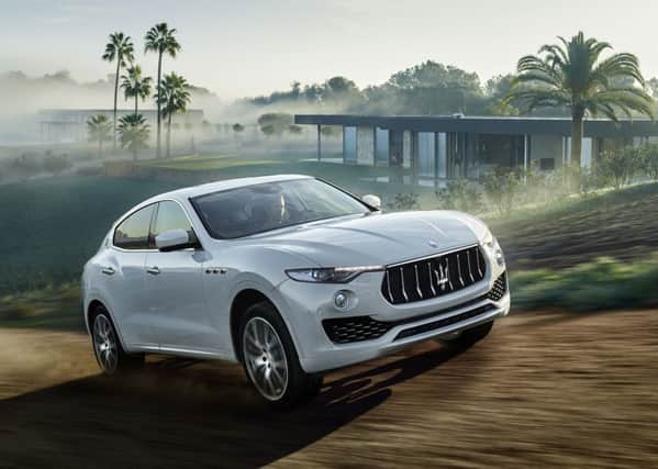 In looks and performance Maseratis first SUV is chasing the success of upscale marques like the Porsche Cayenne