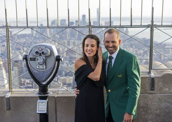 Masters winner Sergio Garcia, with his fiancee Angela Akins, stands on the 86th floor of the Empire State Building in New York. Picture: Craig Ruttle/AP