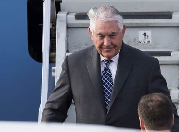 US Secretary of State Rex Tillerson steps out of a plane upon arrival in Moscow's Vnukovo airport. (AP Photo/ Ivan Sekretarev)
