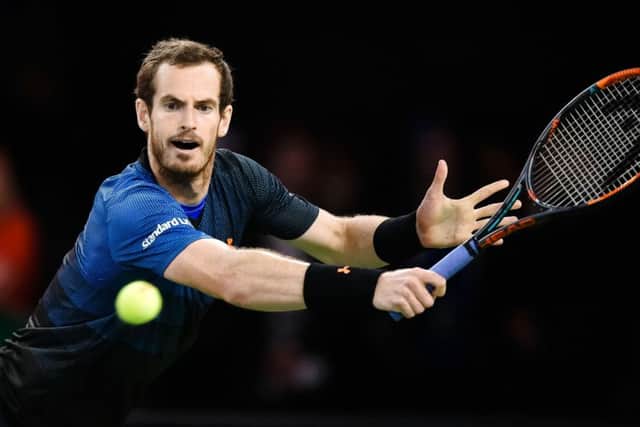 Andy Murray returns the ball to Roger Federer during a charity match in Zurich on Monday. Picture: Michael Buholzer/AFP/Getty Images