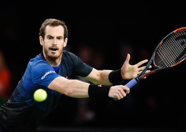 Andy Murray returns the ball to Roger Federer during a charity match in Zurich on Monday. Picture: Michael Buholzer/AFP/Getty Images