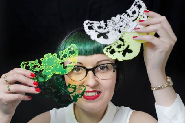 Kirsty Stevens, who uses scans of her brain in her designs, with her Brain Moth Necklaces, Â£70
