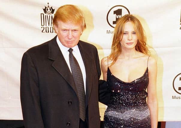 Donald Trump with his then girlfriend Melania in 2000 (Photo: Anthony Harvey/PA Wire)