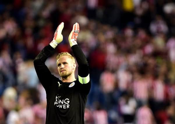 Captain Kasper Schmeichel salutes the Leicester supporters at the final whistle. Schmeichel played a starring role for City, who were forced on to the back foot for much of the game by Atletico. Picture: Gerard Julien/AFP/Getty Images
