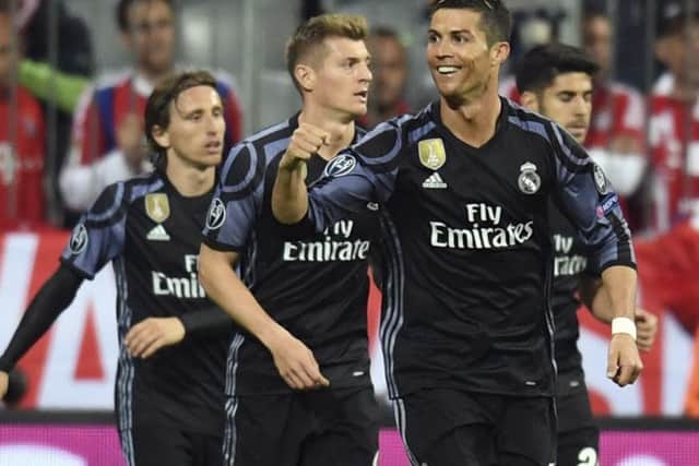 Real Madrid's Cristiano Ronaldo celebrates after scoring the winner in the 2-1 victory over Bayern Munich. Picture: Sven Hoppe/AP
