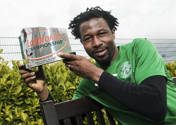 Efe Ambrose, named as the Championship Player of the Month, says Celtic manager Brendan Rodgers was a positive influence.